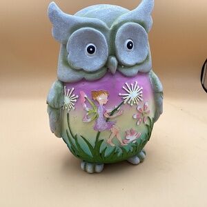 Resin owl with fairy and flowers on front